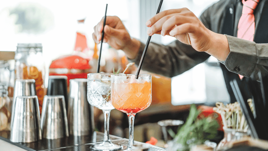 Mixology techniques demonstrating scotch cocktail shaking vs. stirring